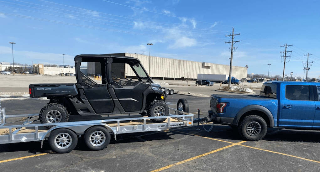 Truck towing a trailer for local towing service in Carlsbad, CA